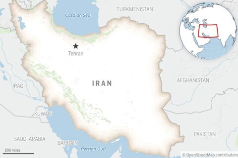 Iran state TV says an Iranian navy helicopter confronted a US destroyer in the Gulf of Oman