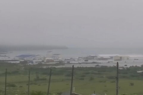 The Latest: Tsunami warnings lifted in most places