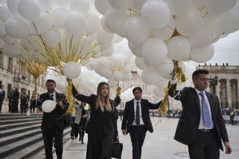 Colombians bid farewell to presidential hopeful Uribe after shooting at political rally