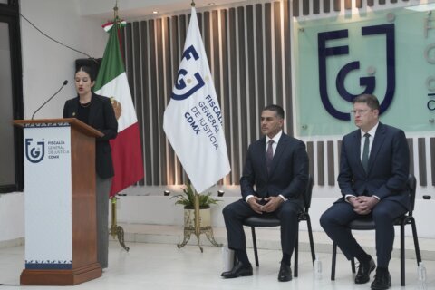 Mexico City mayor says police have arrested 13 in connection with killings of her staffers