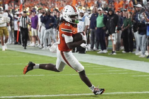 No. 10 Miami digs in late, tops No. 6 Notre Dame 27-24 in a thriller