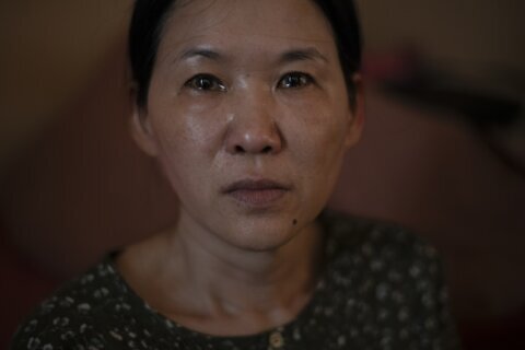 Woman seeks compensation from South Korea over her forced adoption to France in 1984