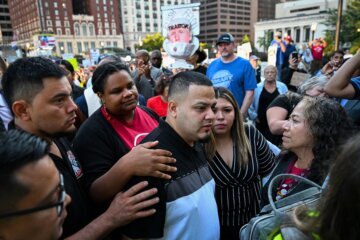 Salvadoran migrant and US resident Kilmar Abrego Garcia walks with his wife Jennifer Vasquez as he arrives at a US Immigration and Customs Enforcement (ICE) field office in Baltimore, Maryland, on August 25.