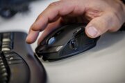 A person uses a computer mouse