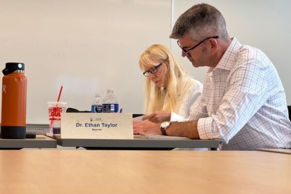 Former federal workers take notes on how to be an effective teacher.