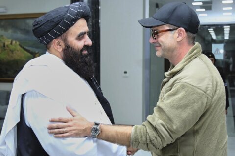Taliban claim an agreement is reached with US envoys on a prisoner swap as they seek better ties