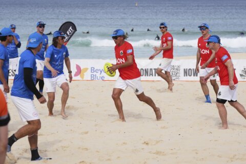 Australian friends claim world record for longest beach touch rugby game
