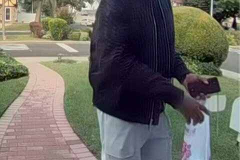 New York City police hunt for man suspected of killing elderly couple and burning their home