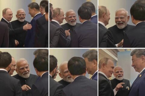 Photos show Modi, Putin and Xi in a huddle