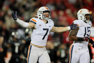 James Jackson #7 of the Virginia Cavaliers celebrates a defensive stop against the Louisville Cardinals at Cardinal Stadium on November 09, 2023 in Louisville, Kentucky.