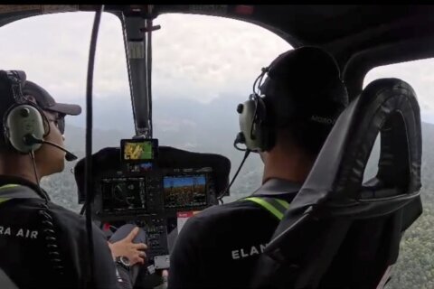 Indonesian rescuers find helicopter crash site on Borneo and recover 1 body so far