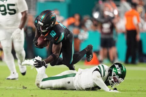 Dolphins’ Tyreek Hill carted off field and taken to hospital with dislocated left knee