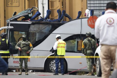 Freight train slams into a bus outside Mexico City and kills at least 10 people