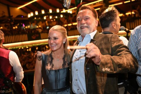Schwarzenegger directs a band in a beer tent at Munich’s Oktoberfest