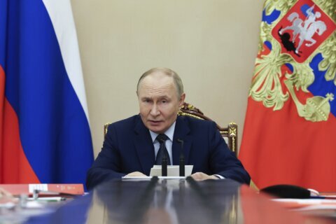 Putin says Russia is willing to abide by nuclear arms deal with the US for 1 year after it expires