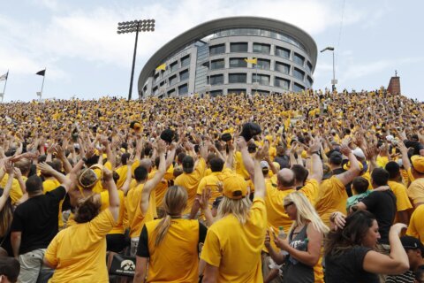 College football traditions: 'Hawkeye Wave' bonds everyone in stadium with kids in adjacent hospital