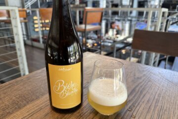 a bottle of beer and a glass