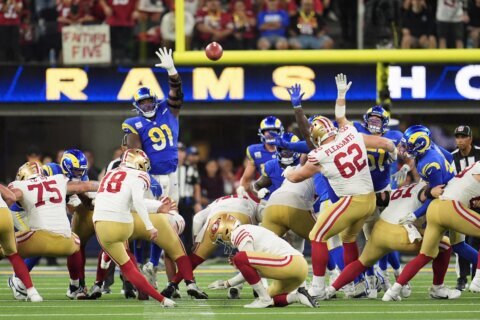 Short-handed 49ers stop Rams on downs in overtime, preserving a 26-23 victory