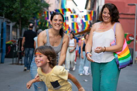 File photo of two women walking with a young boy