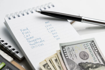 pen and pad and money budgeting