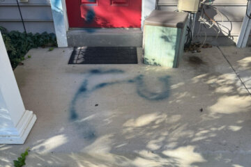 Foul language spray-painted on home