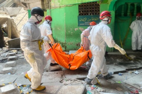 Death toll from Indonesian school collapse rises to 14 as crews pull more bodies from rubble