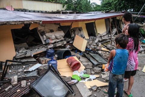 Rescuers desperately search for survivors of earthquake in the Philippines that killed at least 72