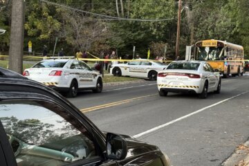 police cars near a school bus