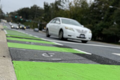 ‘Enhanced’ bike lanes emerge along busy road where Bethesda diplomat was killed in 2022