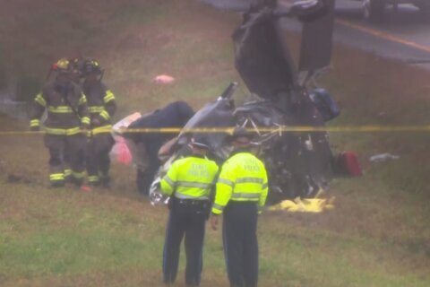 Plane crashes onto a Massachusetts highway, killing 2 on board and hurting 1 motorist