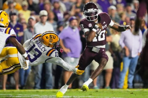 Reed produces 4 TDs and No. 3 Texas A&M races away from No. 20 LSU, 49-25
