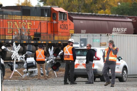 Rail conductor who was struck by a train and killed is identified as a Montana man