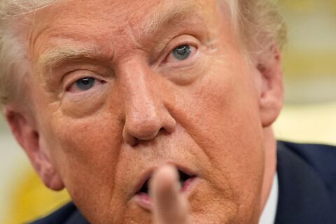 The Latest: Trump pardons Binance founder Changpeng Zhao