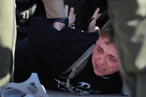 Protesters arrested, officers injured in clash outside Chicago-area immigration facility