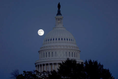 Moon behind the U.S. Capitol