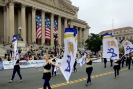Marching band members in parade.