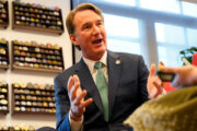 Virginia Gov. Glenn Youngkin gestures during an interview in his office at the Capitol Wednesday Dec. 10, 2025, in Richmond, Va. (AP Photo/Steve Helber)