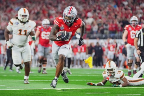 Defending champ Ohio State loses to Miami as teams with first-round byes drop to 0-5 in playoff