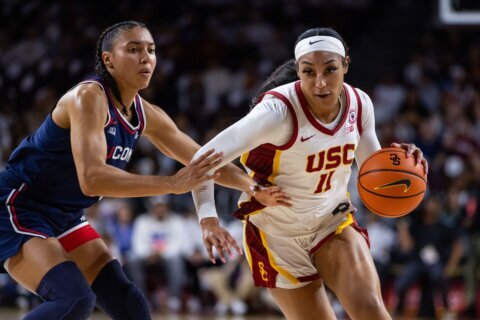 Azzi Fudd leads No. 1 UConn's 79-51 rout of 16th-ranked USC with JuJu Watkins looking on