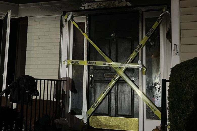 caution tape blocks off front door of home