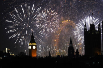 Fireworks light up the sky in central London to celebrate the New Year on Thursday, Jan. 1, 2026. (AP Photo/Alberto Pezzali)