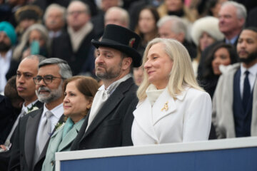 Virginia Gov. Abigail Spanberger sits with her husband Adam Spanberger during inaugural ceremonies at the Capitol in Richmond Va., Saturday Jan. 17, 2026. (AP Photo/Steve Helber, Pool)