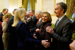 Virginia Gov.-elect, Abigail Spanberger, left, greets former Gov. Ralph Northam, right, and his wife, Pam Northam, center, during in inaugural ceremonies at the Capitol in Richmond Va., Saturday, Jan. 17, 2026. (AP Photo/Pool/Steve Helber)