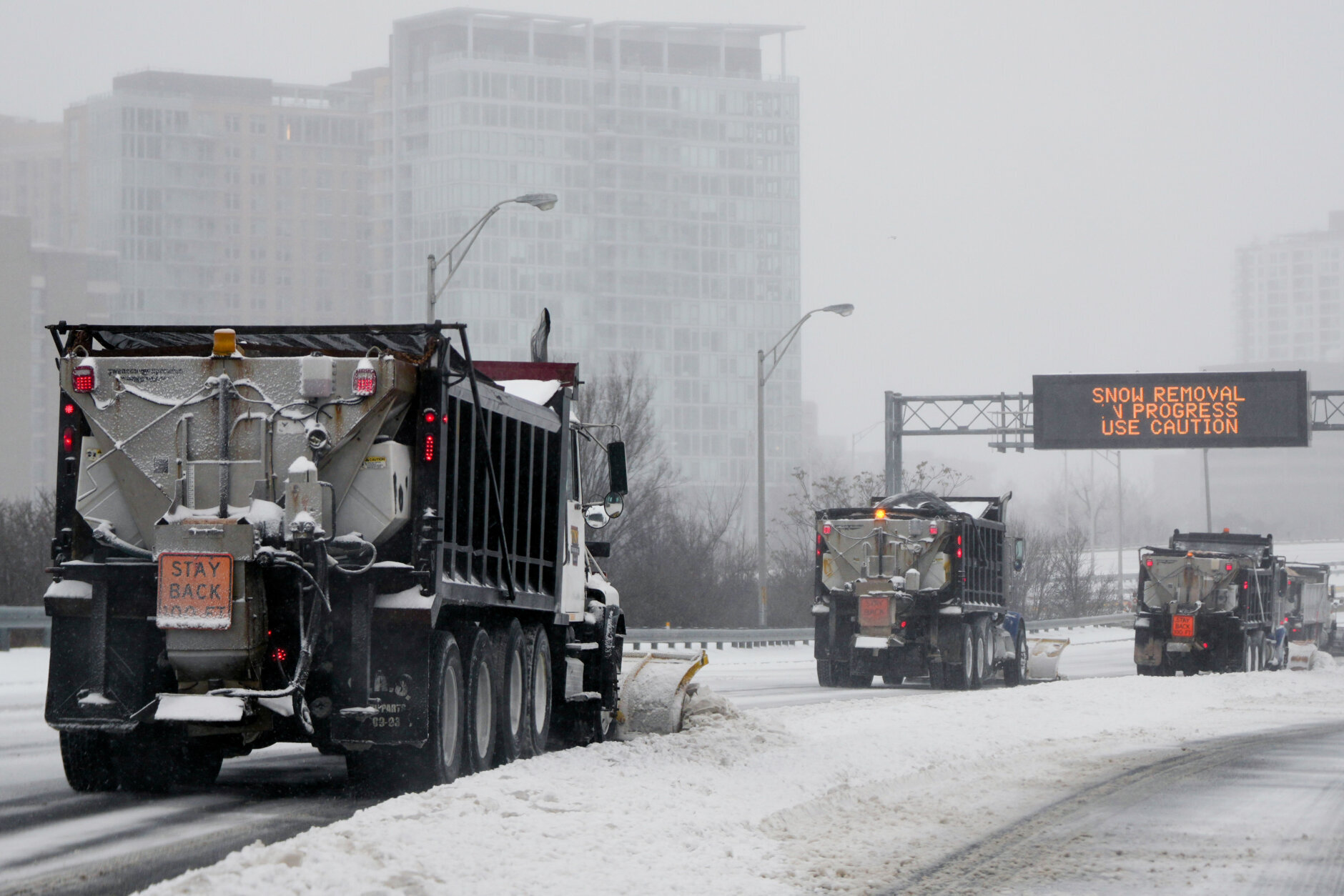Snow plows clear Interstate 395