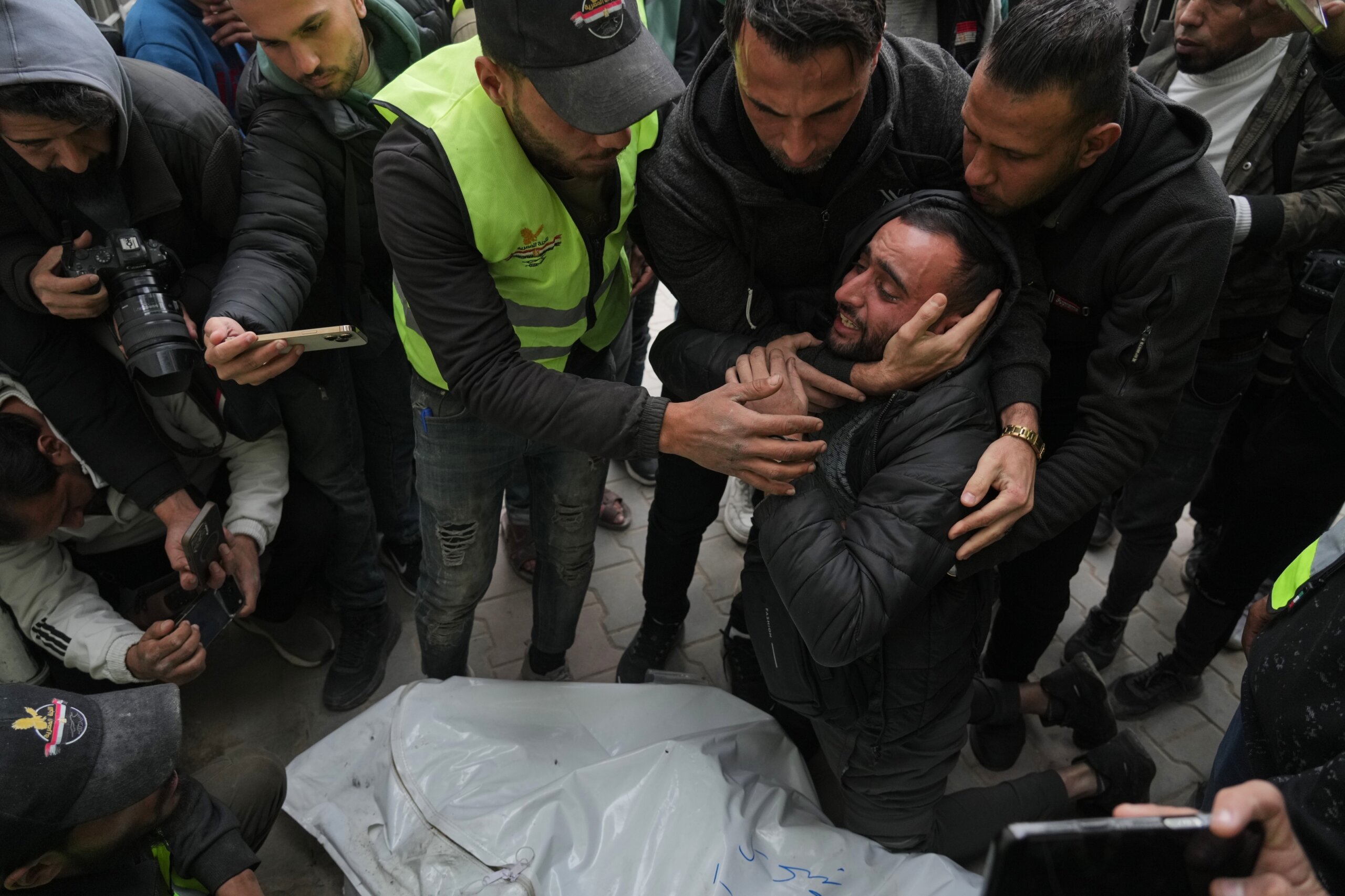 Israeli fire kills 11 Palestinians in Gaza, including 2 children, local hospital officials say