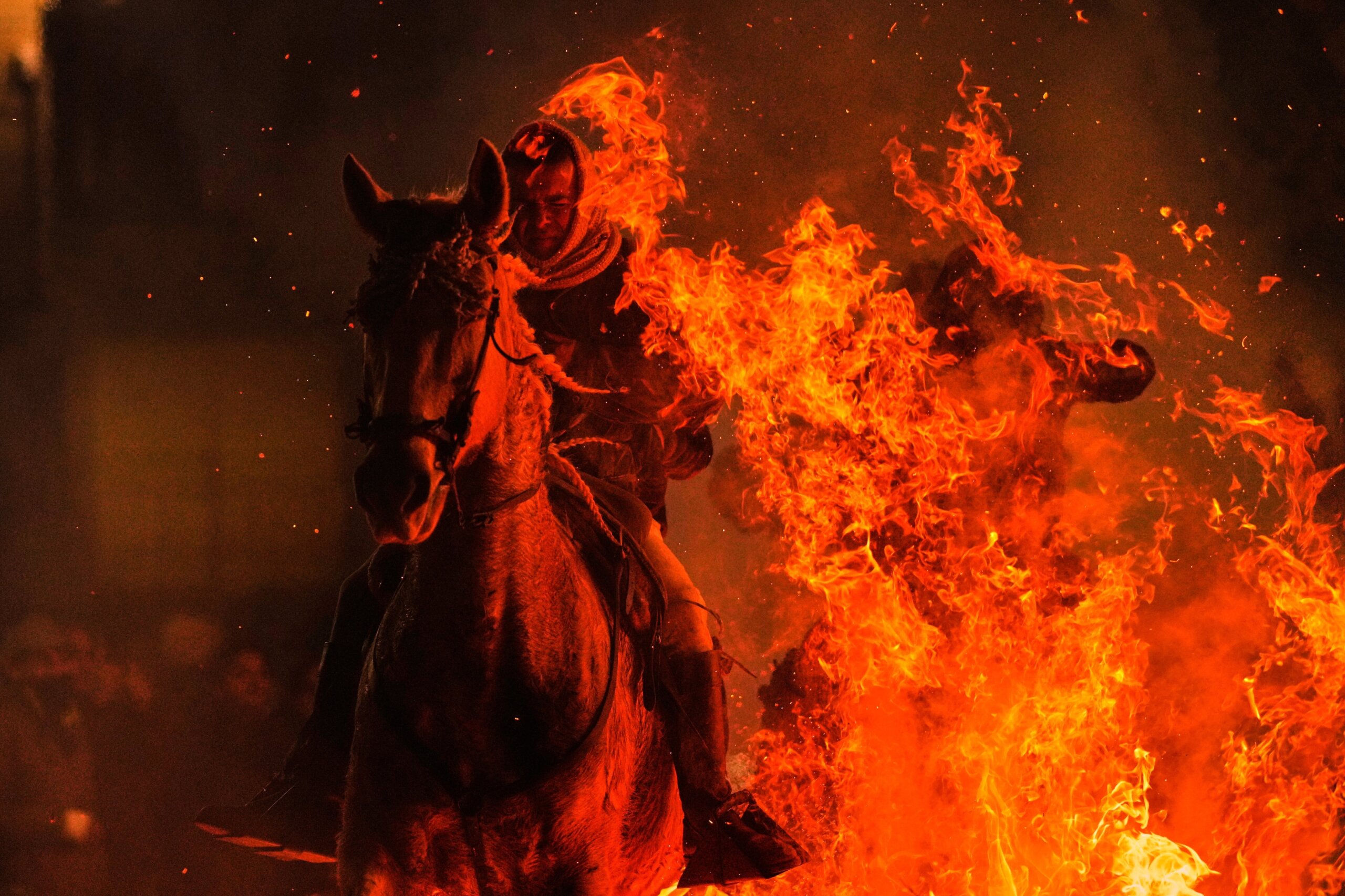 Photos of horses leaping through flames in centuries-old Spanish tradition