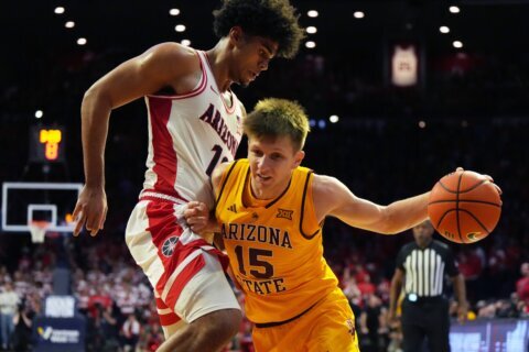 Peat scores 24, No. 1 Arizona remains undefeated with 89-82 win over rival Arizona State