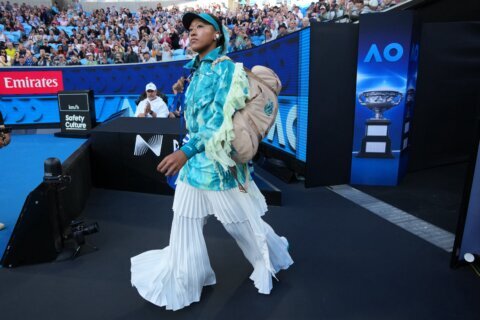 Naomi Osaka tones down her walk-on outfit. Turns up the heat at Australian Open