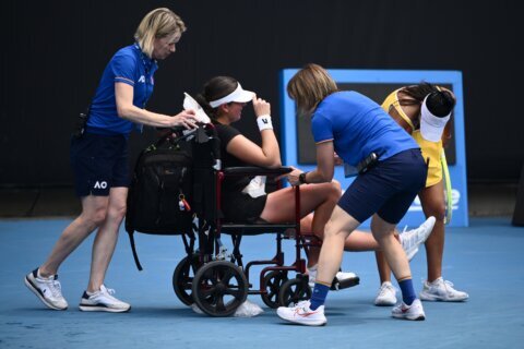 Canada’s Stakusic leaves court in a wheelchair as Australian Open warms up