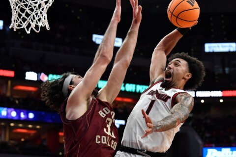 No. 20 Louisville beats Boston College 75-62 as ex-G League player London Johnson is made available